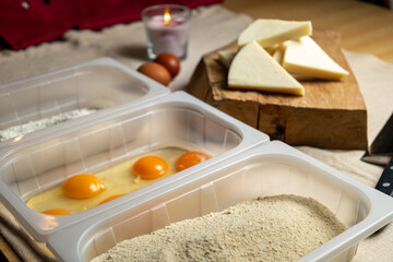 Bread the cheese with eggs and breadcrumbs