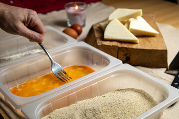Bread the cheese with eggs and breadcrumbs