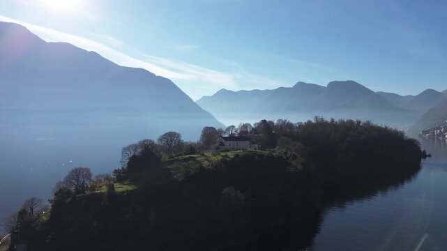 View of Comacina island from the village of Ossuccio on Lake Como
