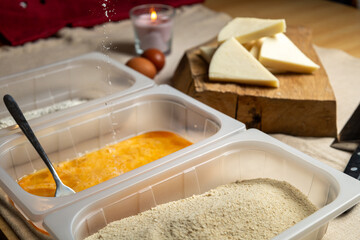 Bread the cheese with eggs and breadcrumbs
