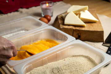 Bread the cheese with eggs and breadcrumbs