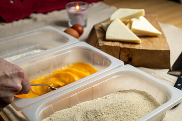 Bread the cheese with eggs and breadcrumbs