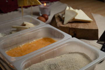 Bread the cheese with eggs and breadcrumbs