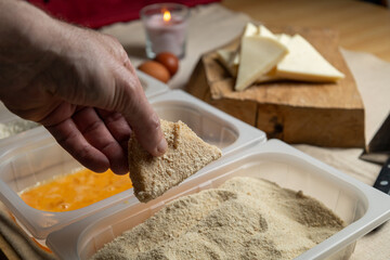 Bread the cheese with eggs and breadcrumbs