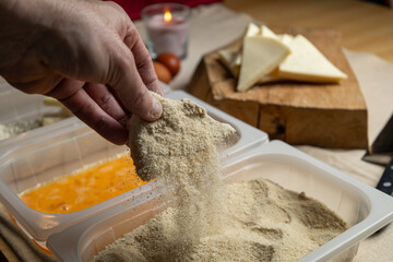 Bread the cheese with eggs and breadcrumbs