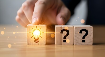 Person's hand illuminates a solution, placing a glowing idea block among questions
