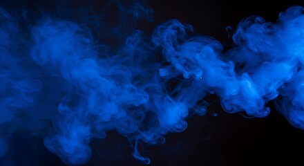 Ethereal blue smoke texture flowing in the dark.