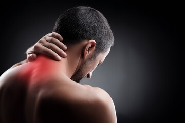 Man experiencing neck pain with red highlight indicating discomfort.