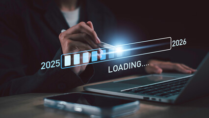 Naklejka na ściany i meble Loading progress bar from 2025 to 2026 represents digital transformation, planning for the future, technology trends, business growth, and new year goal development.