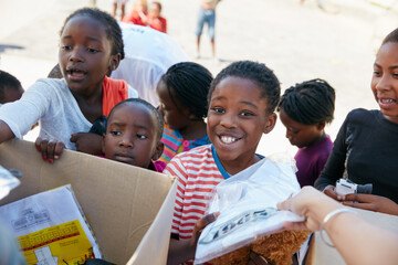 Happy children, boxes and outreach with charity for donation, poverty or volunteering in rural area. Group, NGO or packages with kids or handout for community service or humanitarian aid at orphanage