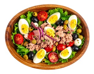 Tuna salad with egg and vegetables in a wooden bowl