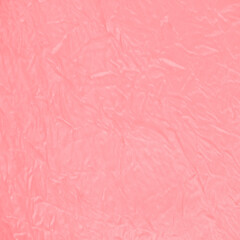 Soft pink wrinkled paper texture background, ideal for feminine design themes, packaging, scrapbooking, creative backdrops, abstract art projects, and decorative surface patterns.