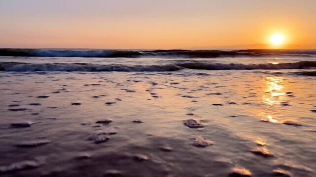 Golden Hour Serenity - Waves Gently Kissing the Shore at Sunset.