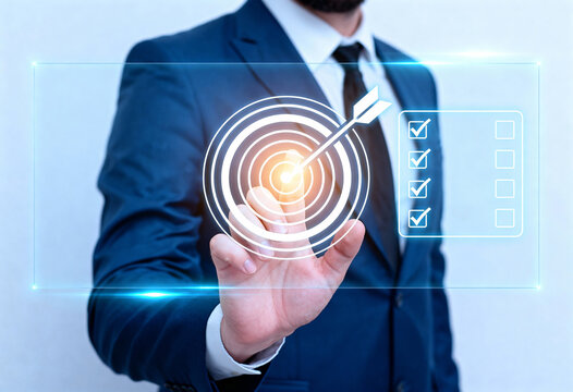 Businessman interacts with a holographic display showing a target and a checklist with completed items