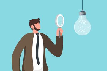 Symbol of failed ideas, lack of innovation, analysis and setting goals for correcting of unprofitable or ineffective business concepts, businessman examining broken lightbulb with a magnifying glass.