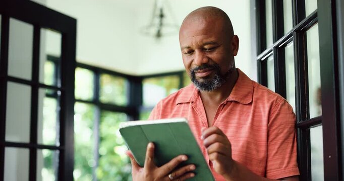 Remote work, reading or black man with tablet in home, proofreading or review article for online publication. Freelancer, research or mature editor with tech to fact check story, grammar or accuracy