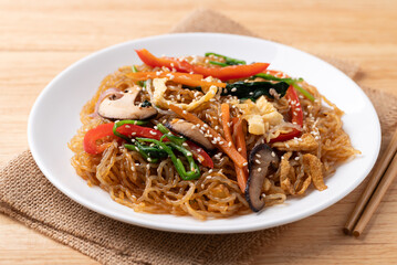 Japchae, Korean stir fried glass noodles with vegetables, pork, soy sauce and sesame seed