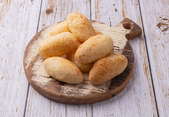Cheese buns, typical south american biscuits on a wooden board