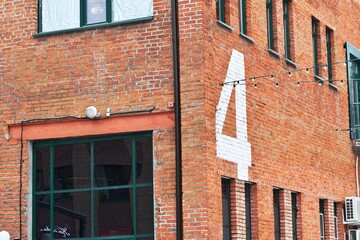 Number nine painted on the wall of a building