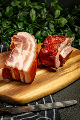 Two pieces of smoked bacon.