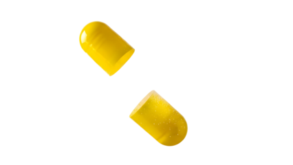 Empty open yellow medicine capsule halves isolated on white background