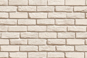 Close-up of beige-toned brick wall, with textured rectangular blocks and mortar seams