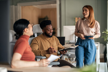 Diverse Team Collaborating on a Project in a Modern Office Setting