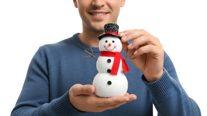 A man holding a snowman and smiling with joy isolated on a transparent background