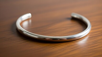 Elegant silver bracelet on wooden surface jewelry and accessory concept
