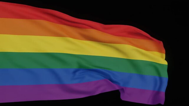 Waving rainbow pride flag with six vibrant stripes against solid black background, symbolizing diversity and inclusion.