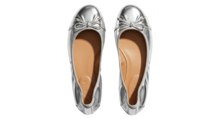 Pair of silver ballet flats with bows on black background