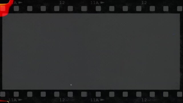 Old damaged film strip scrolling loop