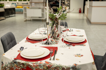 Elegant table setting in modern dining room with festive decor
