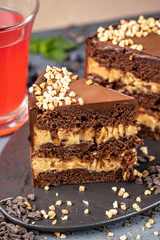 Closeup chocolate nut cream cake slice