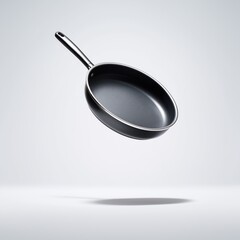 Frying pan levitating in bright studio setting