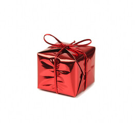 red metallic shiny and reflective gift box with red ribbon. White background.  