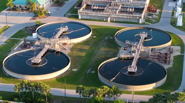 Industrial water treatment facility with water cleaning cisterns and piping system.