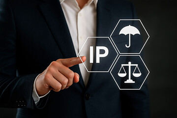 Business person selecting IP icon for the concept of intellectual property and law.