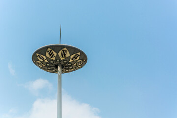 Captivating Futuristic Outdoor Light Structure Against a Clear Blue Sky