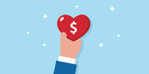 A hand holding a red heart with a dollar sign inside it