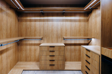 Luxurious dressing room featuring custom shelving and refined finishes