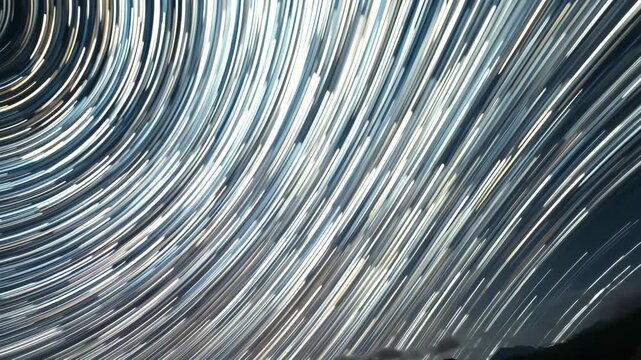 A vibrant blue design of fiber optic cables creates a motion pattern of light spots and textured lines 