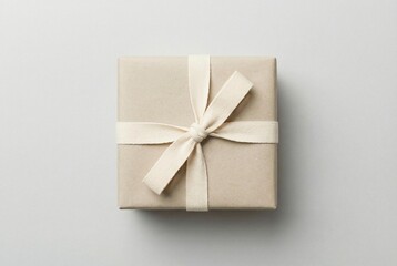 Wrapped beige gift box with cotton ribbon in quiet luxury style