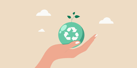 A hand gently holds an egg with a recycling symbol and sprouting leaves