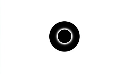 Black donut-like shape with central dark circle, slight white glow on perimeter