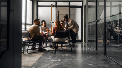 Diverse Team Discussing Ideas in a Modern Office Setting