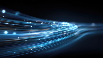 Abstract blue light trails with sparkling particles moving rapidly on a dark background