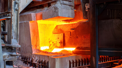 A large melting furnace glass. Glass manufacturing industrial factory. Glass plant.