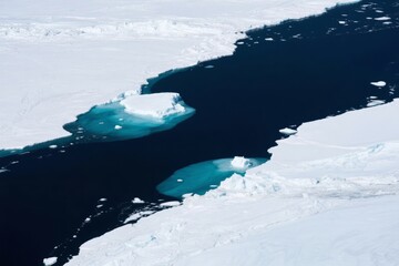 Aerial view of melting ice sheets and dark ocean water in a polar region
