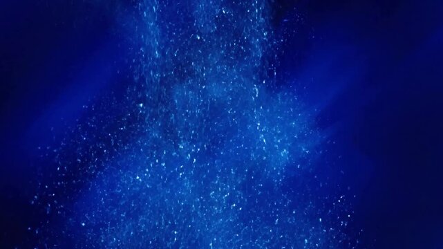 Glitter Particle Bloom with blue glitter particles falling in effect abstract background style featuring glitter, blue, particles,